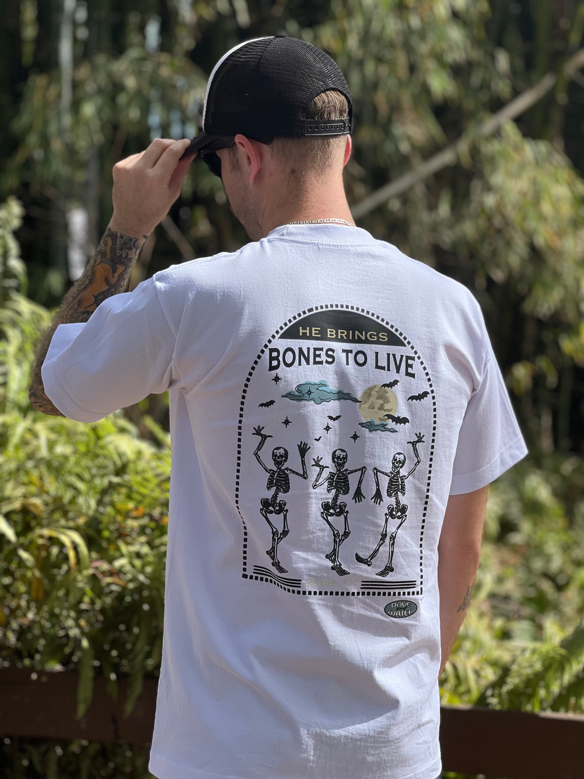 He brings bones to live t-shirt featuring dancing skeletons under moonlight, ezekiel bible verse, he removes our transgressions, inspirational graphic shirt clothing christian apparel jesus inspired to spread the word and good news of jesus, church apparel